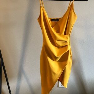 Yellow tight fitting dress. Lightly worn.